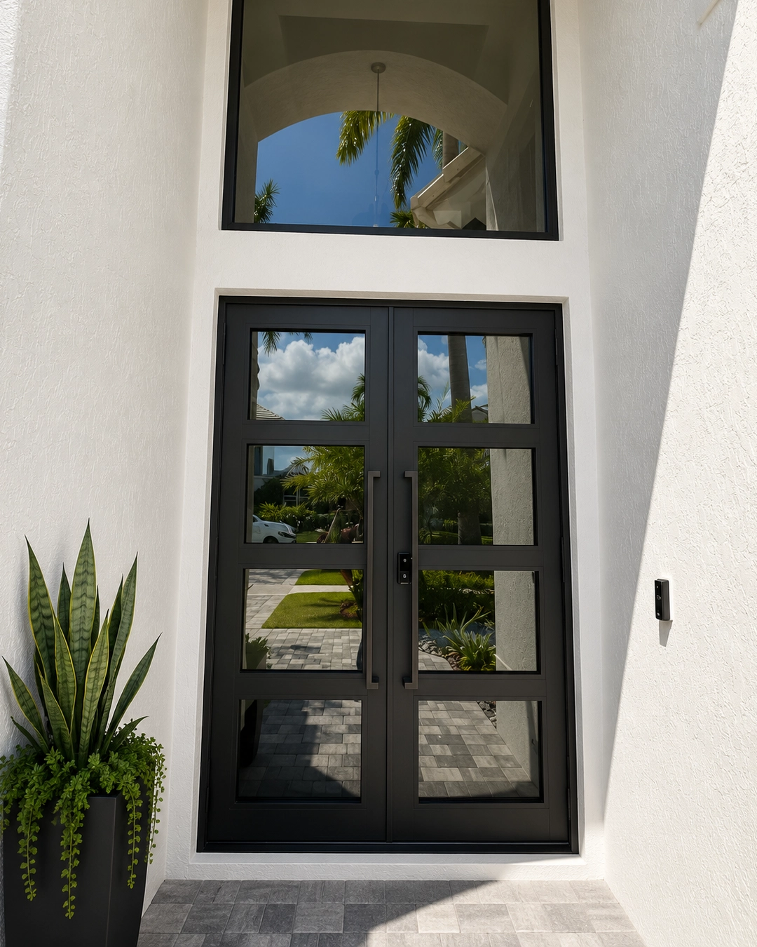 Contemporary impact glass garage door installed at a South Miami home
